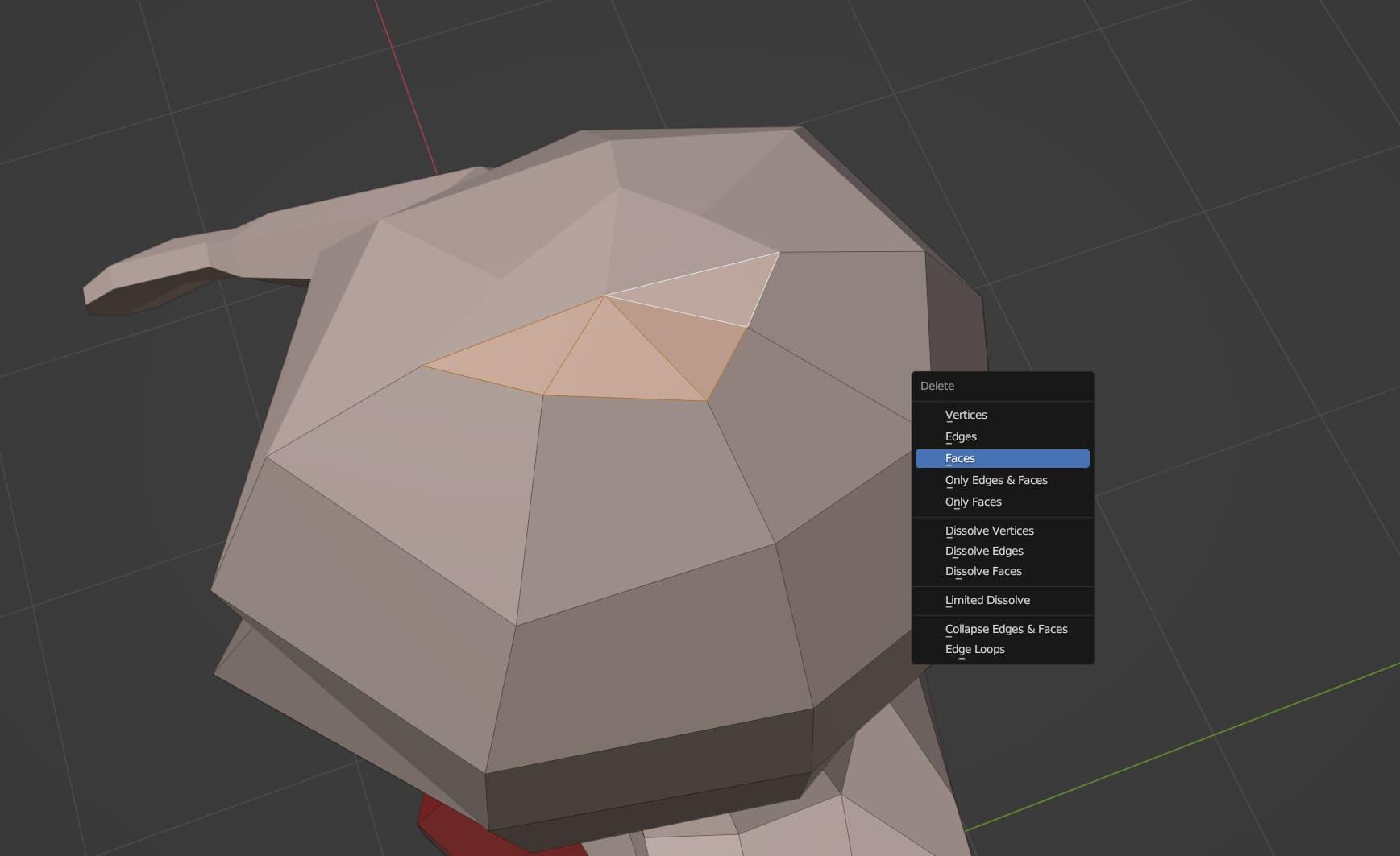 A number of small faces on the top of the head have been selected, and the Delete Faces option in the context menu is highlighted