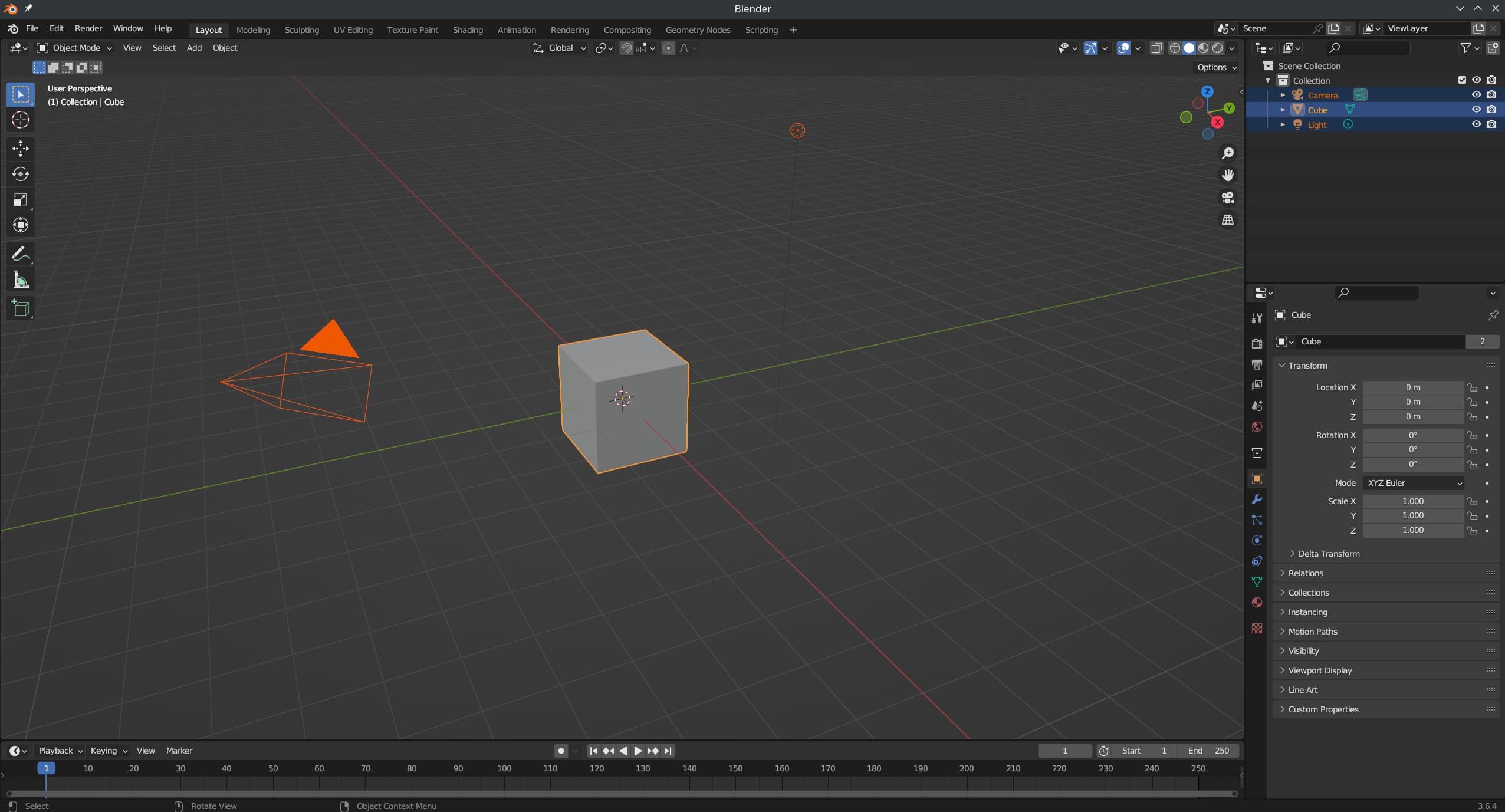 A Blender screenshot shows a grey cube with an orange outline, and two orange shapes representing a camera and a light