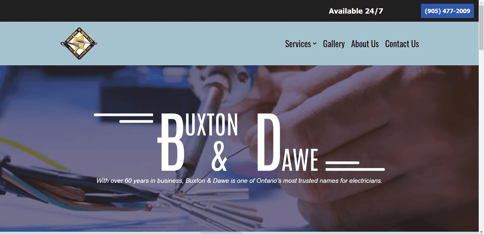 The full-page website 'hero' section. Buxton & Dawe's iconic logo is displayed over footage of electrical work